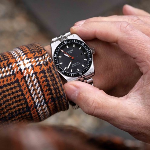 black-dial Tissot PR516 Powermatic 80 with bracelet, on wrist