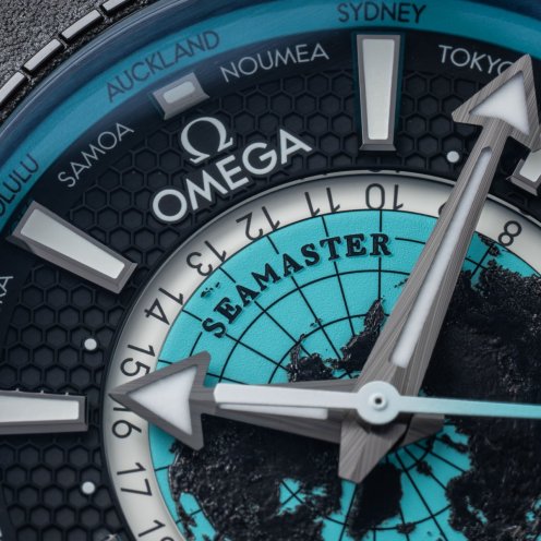 Omega Seamaster Planet Ocean Worldtimer Deep Black with turquoise accents, dial close up
