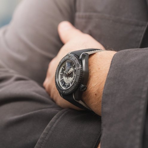 Omega Seamaster Planet Ocean Worldtimer Deep Black with gray accents on wrist