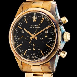 gold Rolex Chronograph ref. 6238 "Pre-Daytona" with black dial and Oyster bracelet