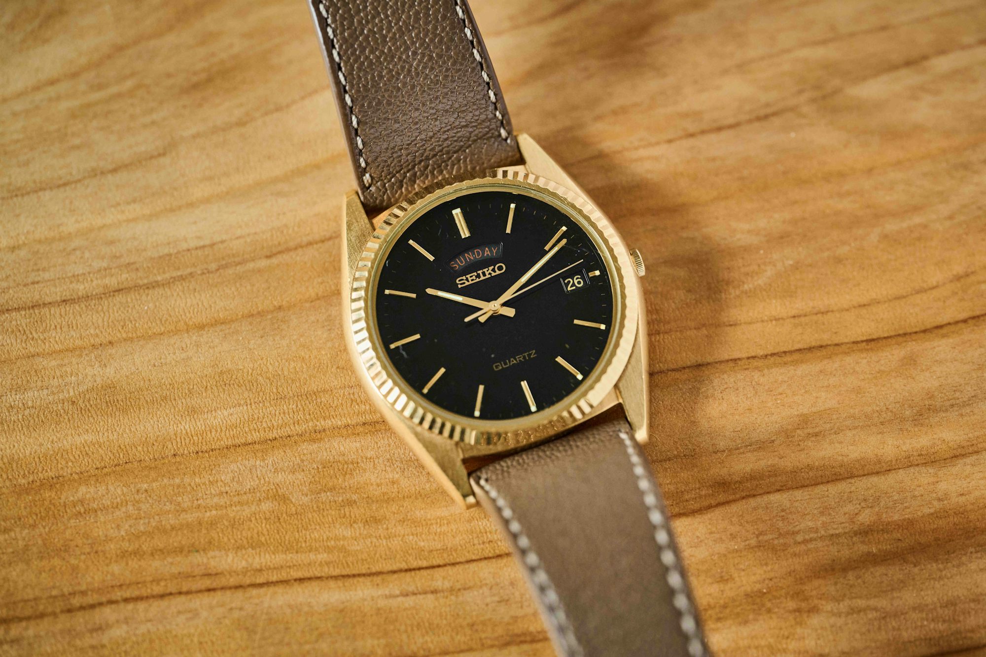 a gold tone seiko dress watch