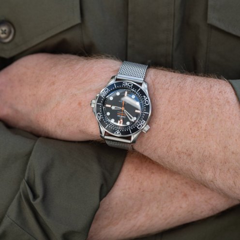 Omega Seamaster Diver 300M ref. 210.30.42.20.01.018 on wrist, arms crossed